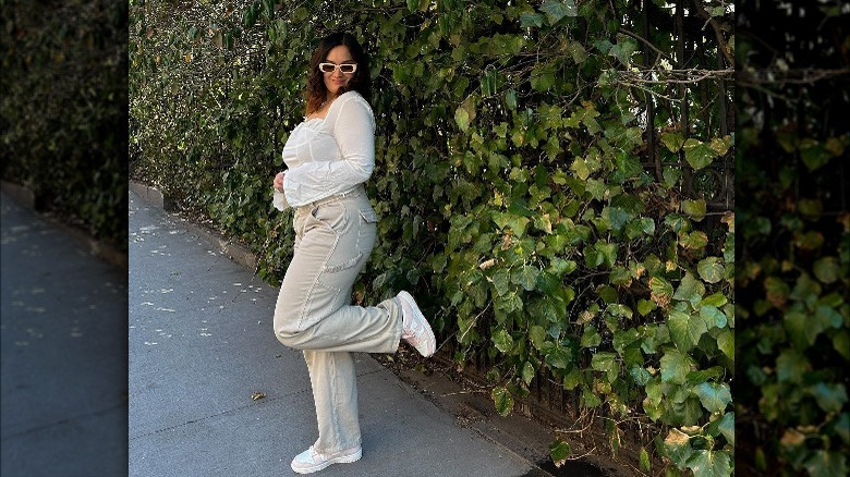 Smiling woman with sheer top and pants