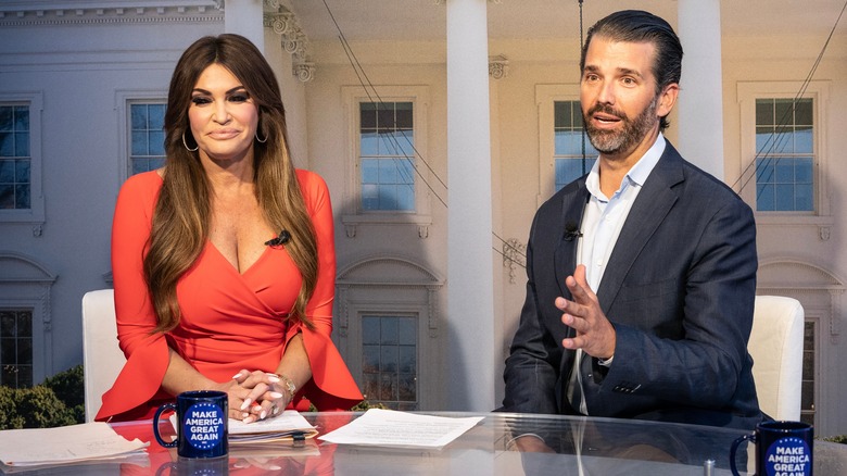 Kimberly Guilfoyle and Donald Trump Jr. sitting together