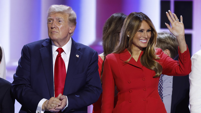 Donald Trump clapping; Melania Trump waving