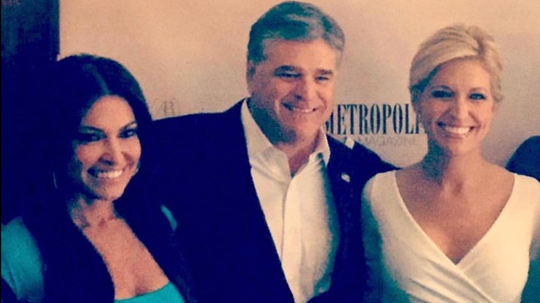 Kimberly Guilfoyle, Sean Hannity, and Ainsley Earhardt posing for a photo, 2017