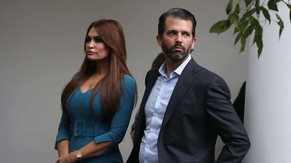 Kimberly Guilfoyle and Donald Trump, Jr. frowning