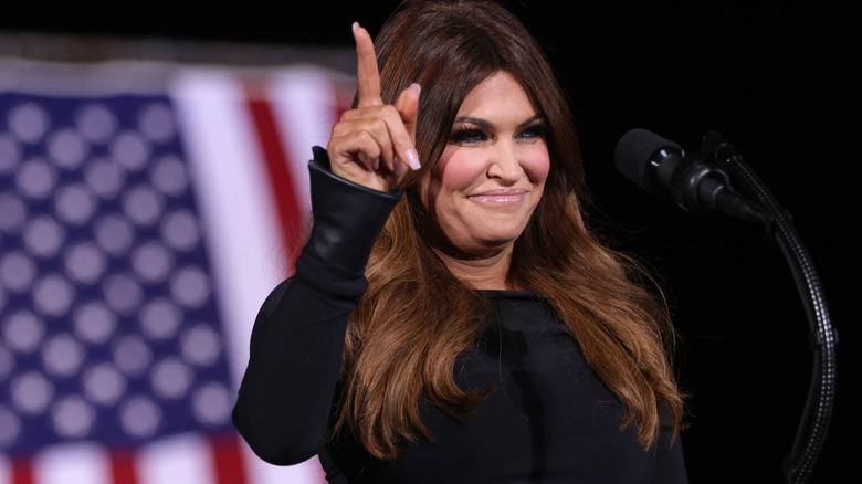 Kimberly Guilfoyle pointing up at podium