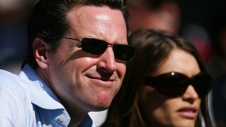 Gavin Newsom smiling next to Kimberly Guilfoyle