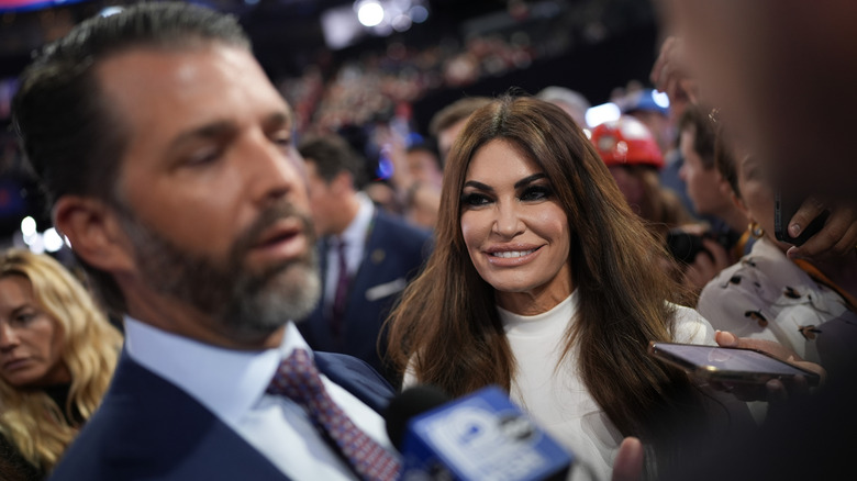 Kimberly Guilfoyle watching Donald Trump Jr. during interview