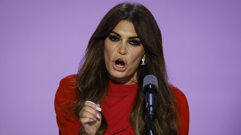 Kimberly Guilfoyle speaking into a microphone on stage