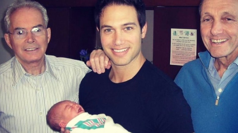 Anthony Guilfoyle, Eric Villency (holding Ronan), Robert Villency posing