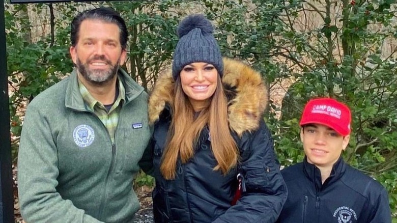 Donald Trump Jr., Kimberly Guilfoyle, Ronan Villency posing