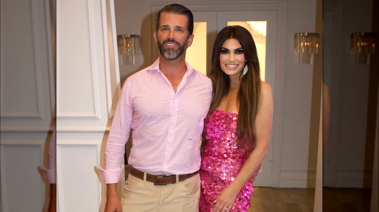 Donald Trump Jr. with his arm around Kimberly Guilfoyle