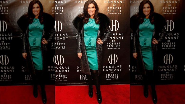 Kimberly Guilfoyle green satin dress and coat with fur collar