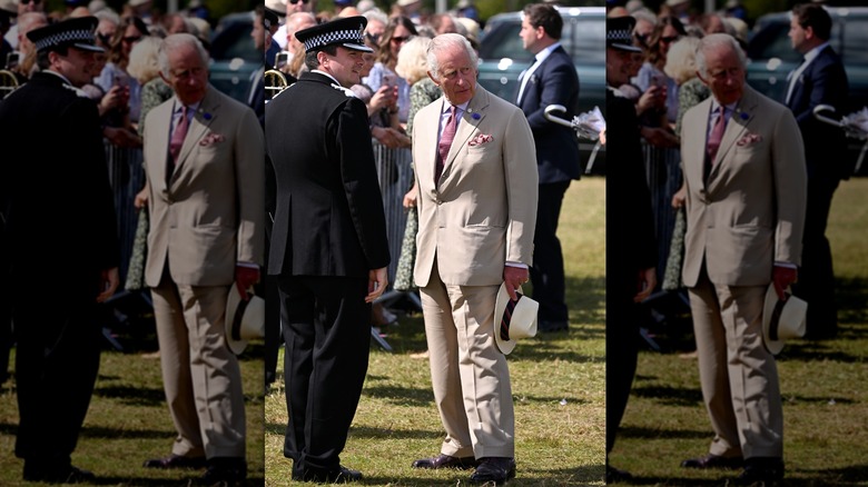 Charles in a beige suit 