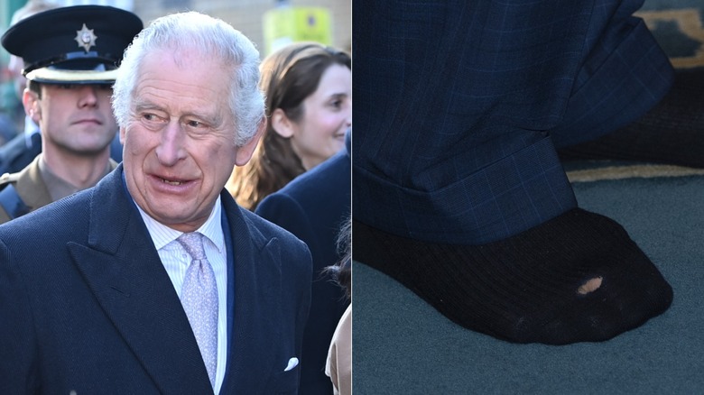 A close-up of Charles' black sock featuring a hole in the top