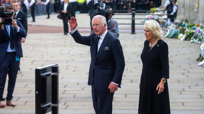 King Charles waving at the camera 