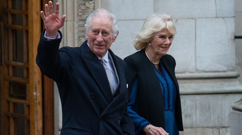 Charles and Camilla wave leaving hospital 2024