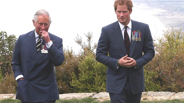 Prince Charles and Prince Harry walking