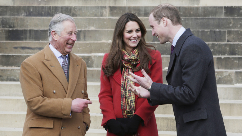 King Charles laughing with Kate Middleton and Prince William