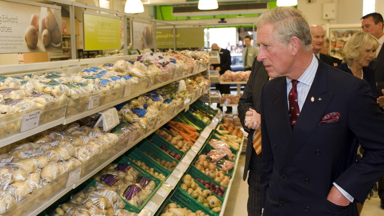 King Charles looking at produce