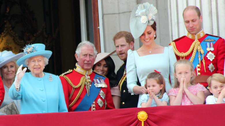 Queen Consort Camilla, Queen Elizabeth II, King Charles III, Meghan Markle, Prince Harry, Kate Middleton, and Prince William on Buckingham Palace balcony