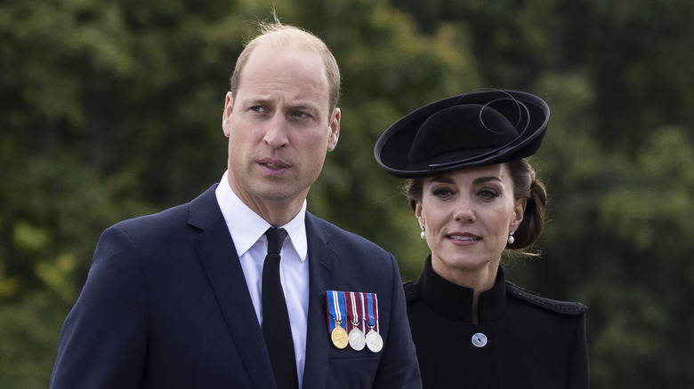 William and Catherine  looking off to the side