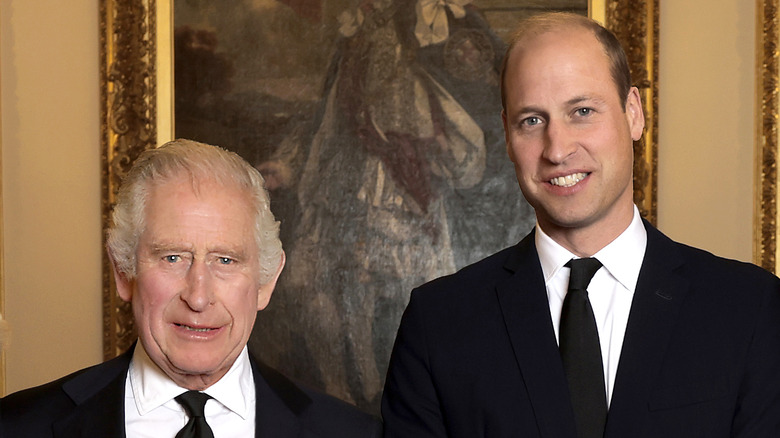 King Charles and Prince William smiling