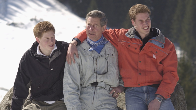 King Charles with Princes William and Harry smiling