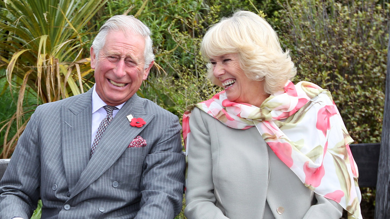 King Charles and Camilla enjoy a laugh