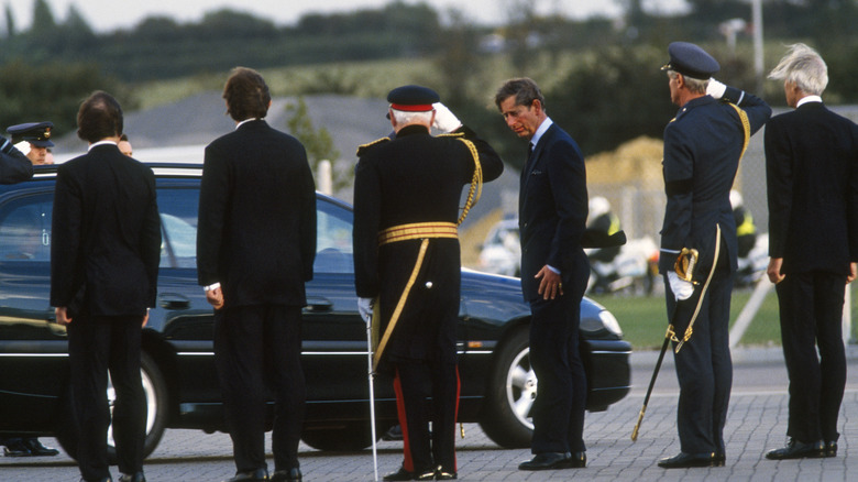 Charles with Diana's coffin