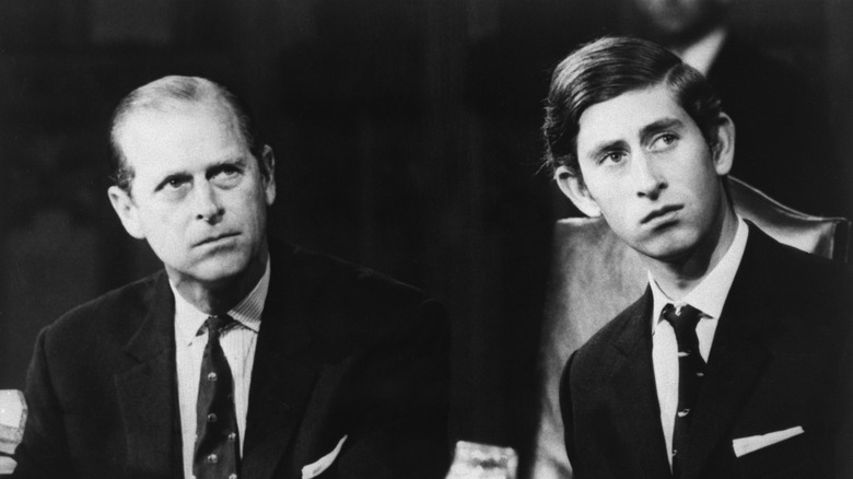 Black and white image of King Charles and Prince Philip in 1970s