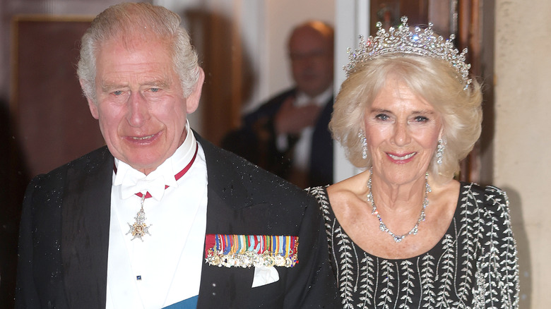 King Charles and Queen Camilla arm in arm