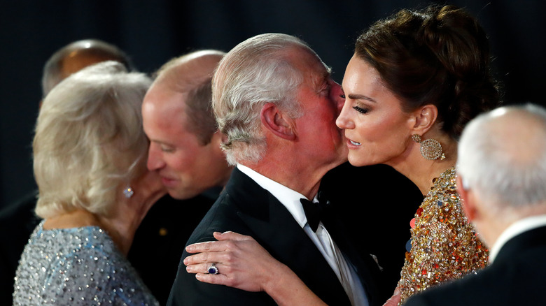 King charles kising kate middleton on the cheek