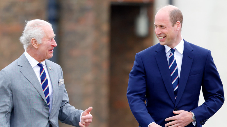 King Charles III and Prince William laugh together