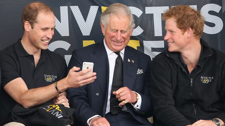 Prince William, King Charles III, Prince Harry laughing together