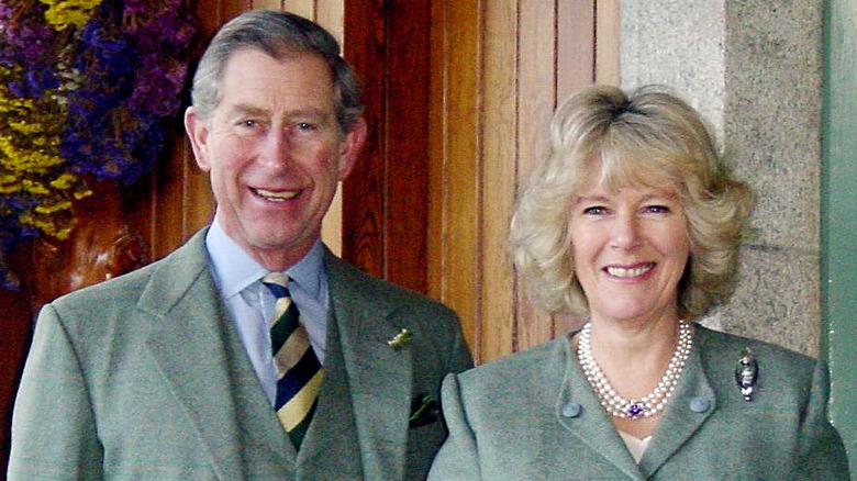 King Charles and Queen Camilla smiling at Birkhall