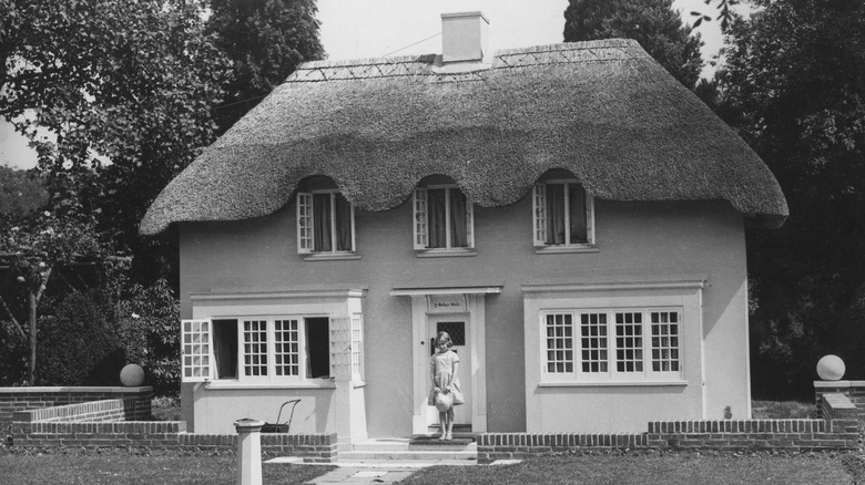 Then Princess Elizabeth in front of her childhood cubby house in 1933