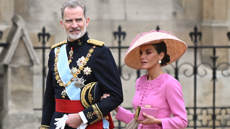 King Felipe and Queen Letizia looking serious and formally dressed at King Charles' coronation