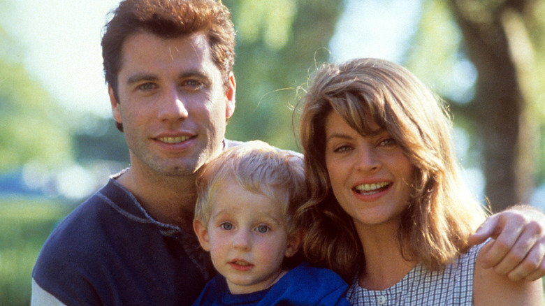 Travolta and Alley posing on set