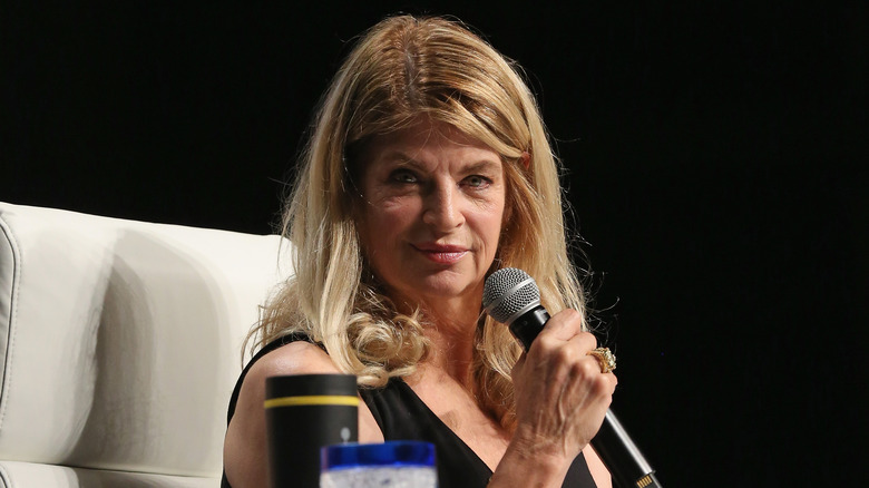 Kirstie Alley speaks into a microphone