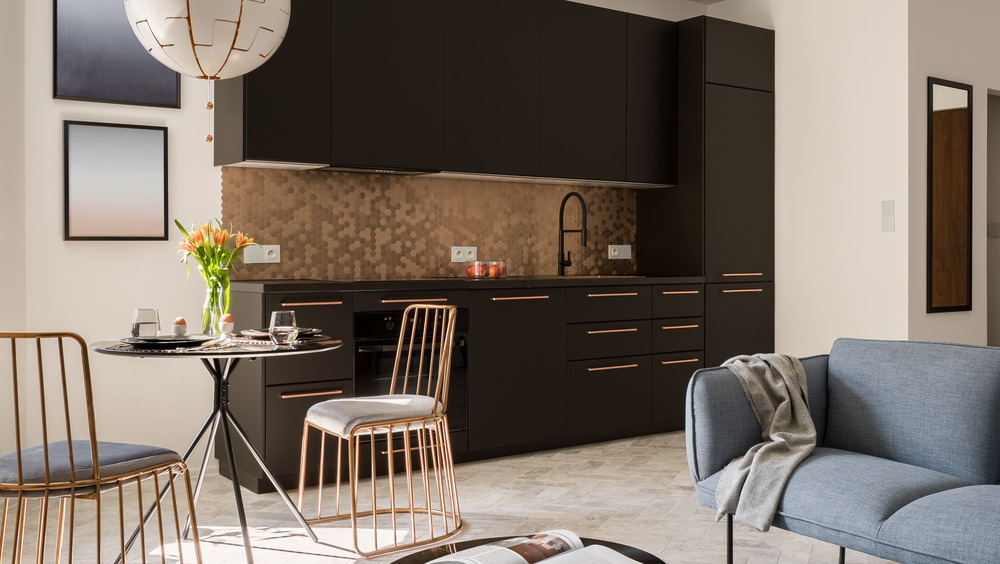 Black kitchen with gold accents