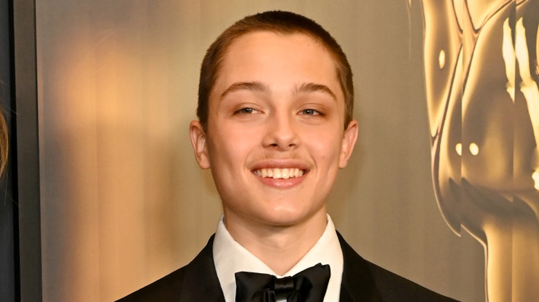 Knox Jolie-Pitt smiles at a red carpet event