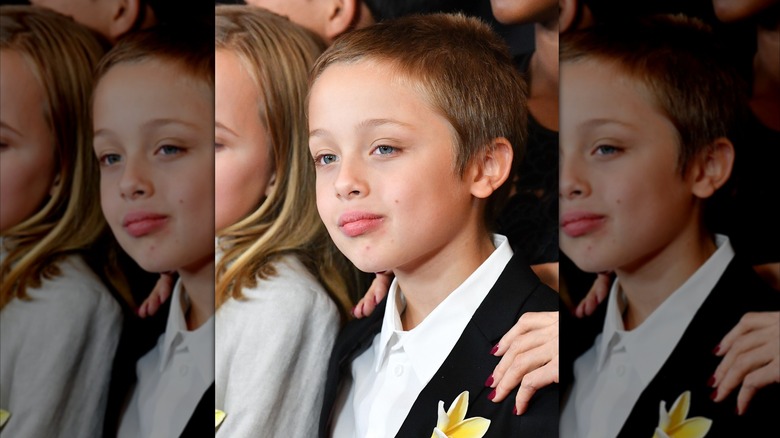 Young Knox Jolie-Pitt smiling at an event