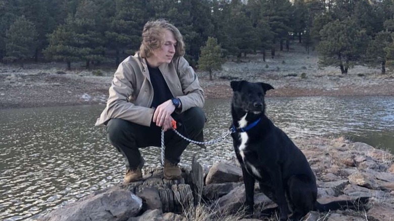 Gabriel Brown holding his dog on a leash