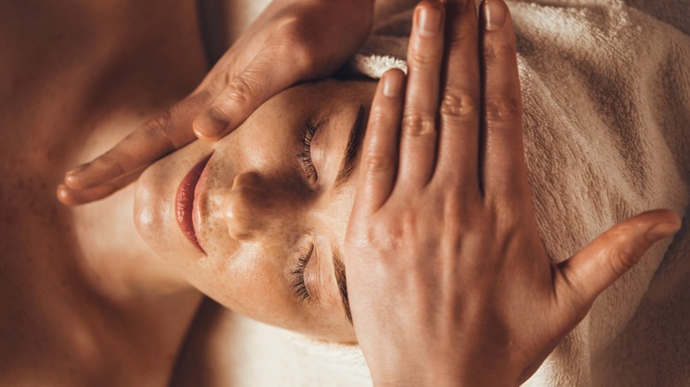 Woman getting facial massage