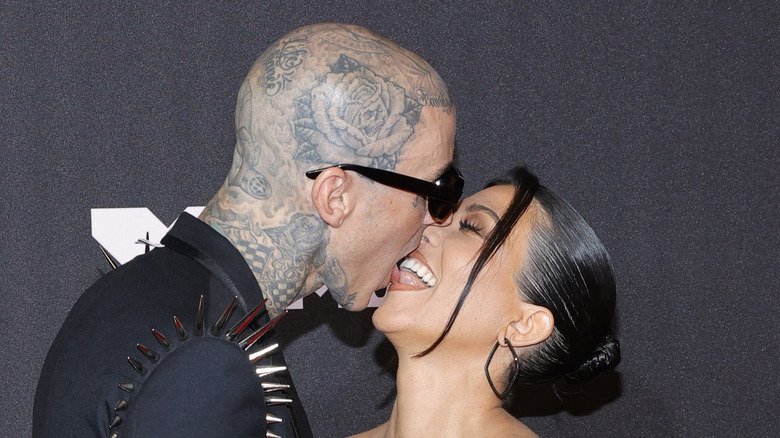 Kourtney Kardashian and Travis Barker touch tongues