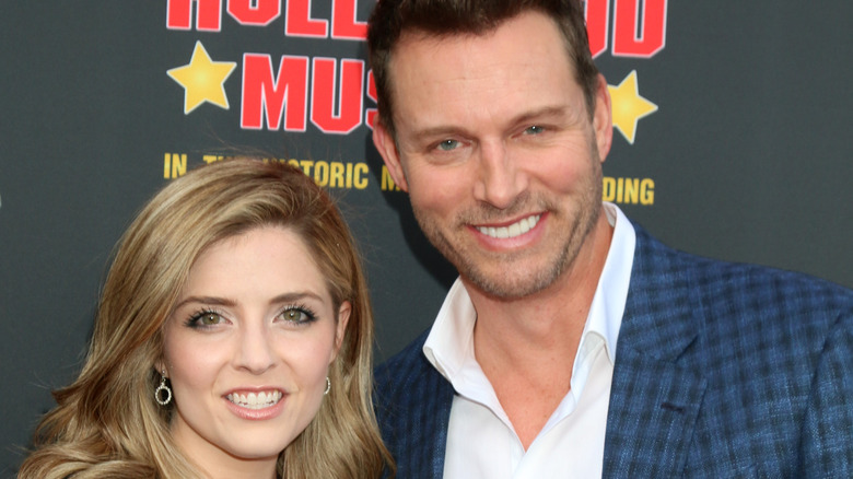 Jen Lilley and Eric Martsolf pose together.