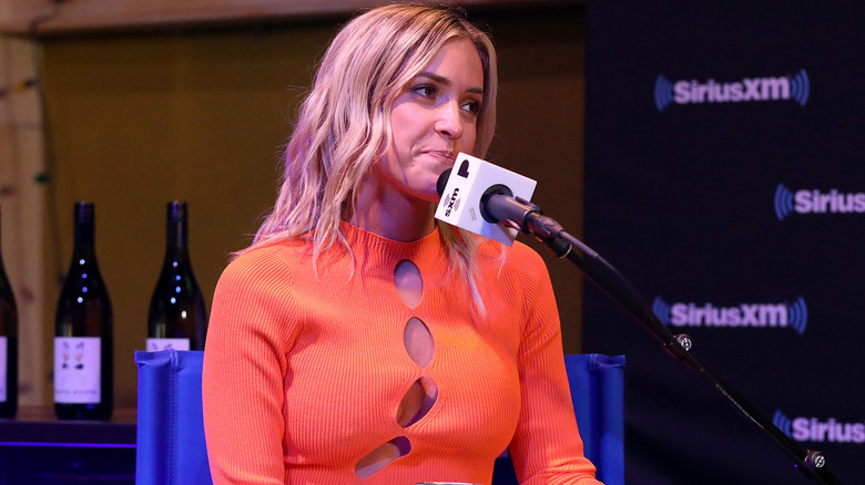 Kristin Cavallari speaking into microphone