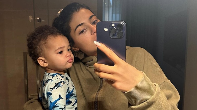 Kylie Jenner taking selfie with her son