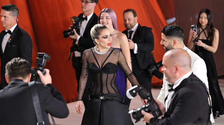 Lady Gaga pausing on red carpet at Oscars