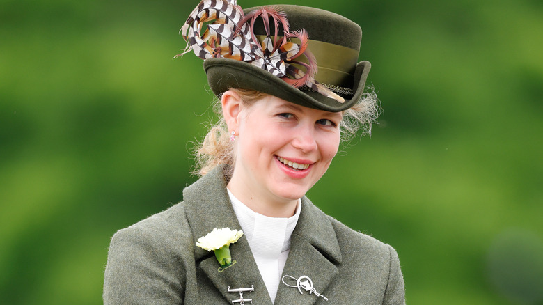 Lady Louise Windsor wearing feather hat smiling