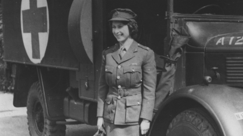 Queen Elizabeth II smiling in military uniform