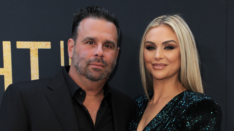 Randall Emmett and Lala Kent posing on red carpet 