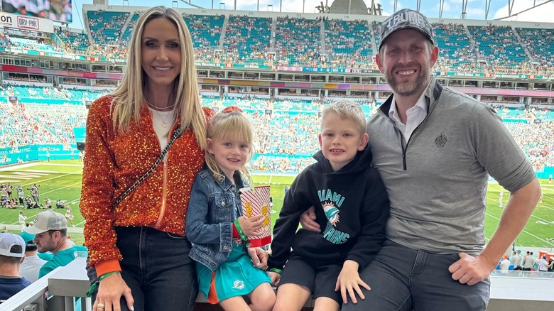 Lara Trump and Eric Trump posing with their kids